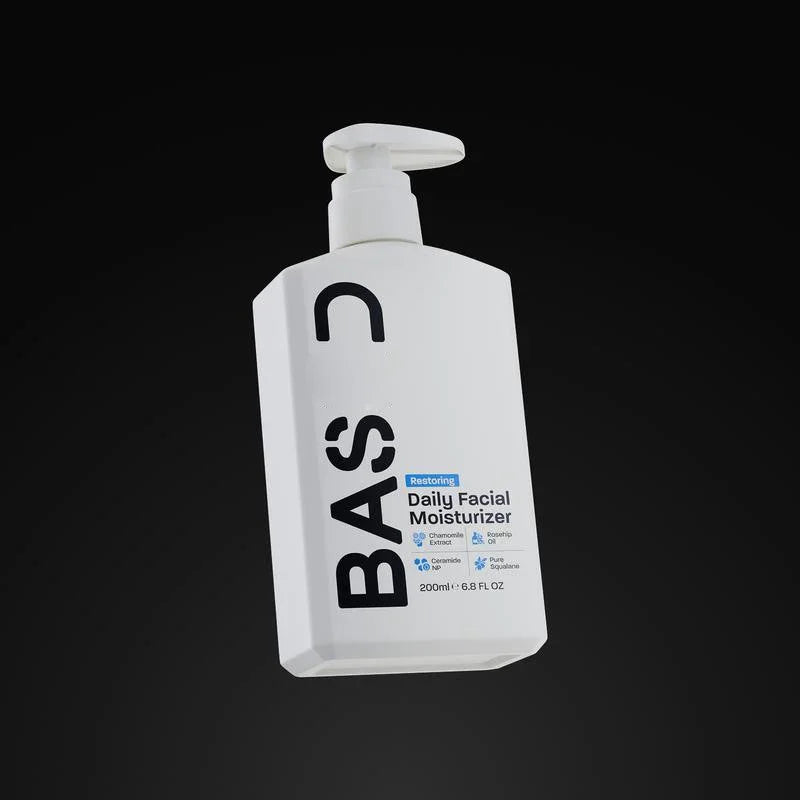 BASC Restoring Daily Facial Moisturizer bottle on black background, skincare product at GlamJust